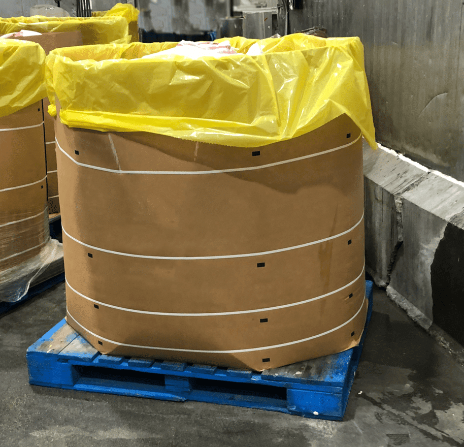 Meat in bulk container cardboard boxes requires straps to help reduce bulging and the potential for rupture at the glue joints.