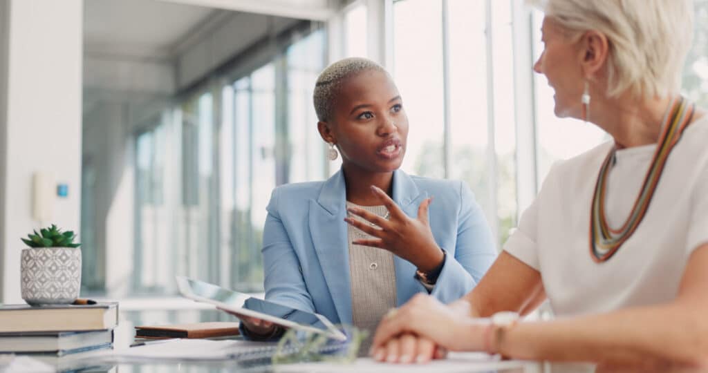women in discussion; they are in business meeting for planning, communication and ideas.
